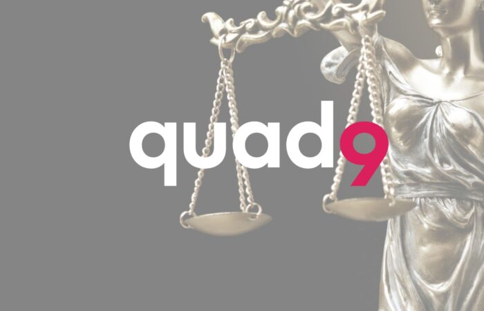 statue of lady justice on right with quad9 logo