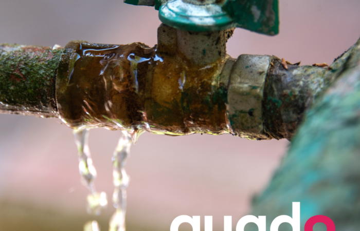 rusted faucet and pipes with Q9 logo