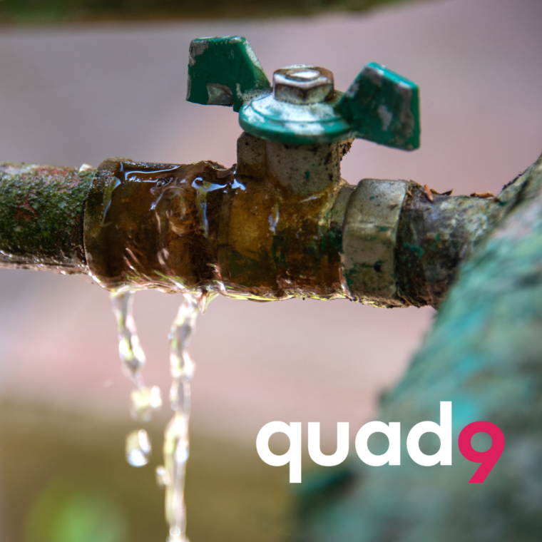 rusted faucet and pipes with Q9 logo
