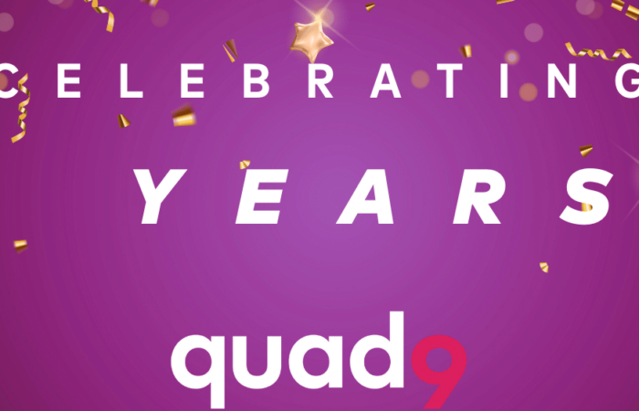 purple background with gold confetti celebrating 5 years of quad9