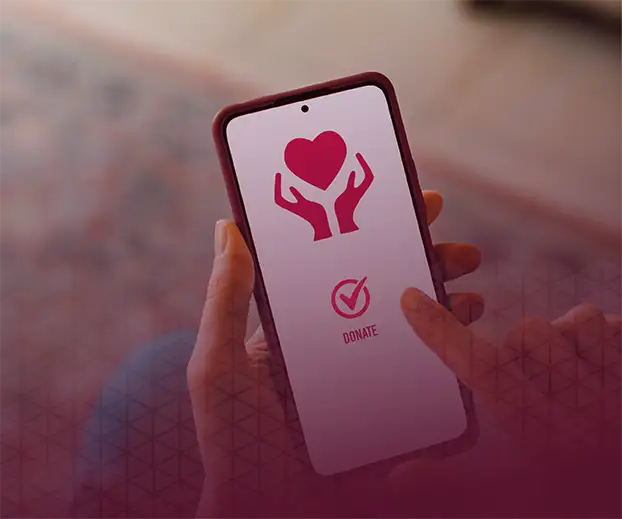 Woman holding up a mobile phone with a quad9 donate page.