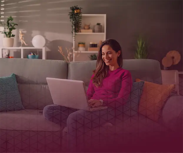 Woman smiling on a computer video conference call.