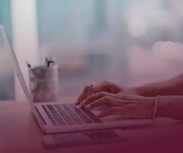 Woman typing on a computer keyboard for quad9 sponsor's page.