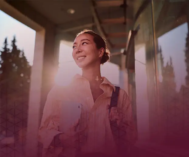Woman walking into a professional workplace on the quad9 careers page.