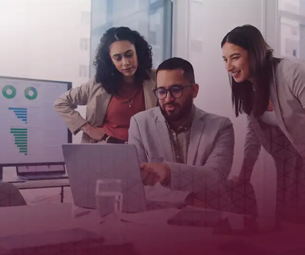 Image of 3 people looking at the computer screen for the Quad9 The Latest page.